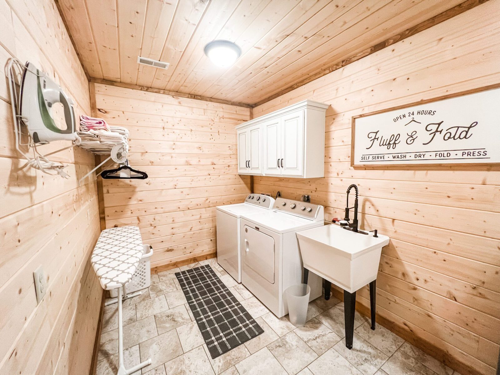 Laundry room with washer and dryer for guests