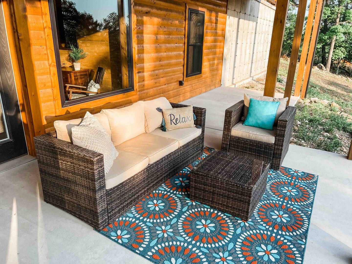 Patio seating with wicker sofa and turquoise accents